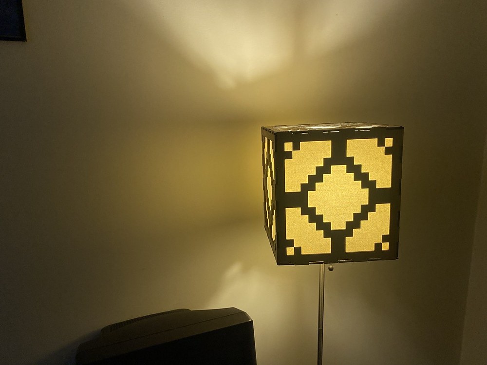 The finished redstone lamp glowing in a corner